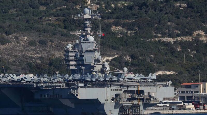 Aircraft are on the deck of the USS Gerald R. Ford aircraft carrier at Souda Bay on the island of Crete