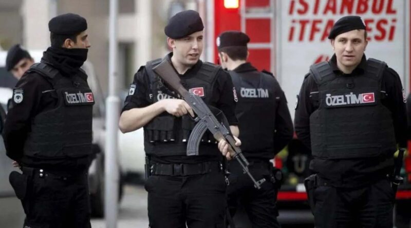 Turkish riot police stand guard in front of the Justice Palace in Istanbul
