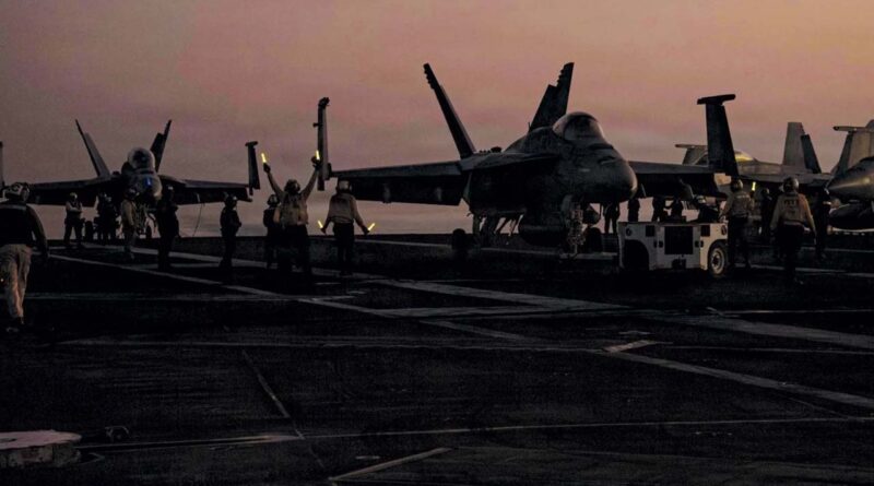 US fighter jets prepare to take off from the aircraft carrier USS Abraham Lincoln in the Arabian Sea