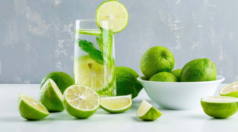 a glass of water and lemon slices