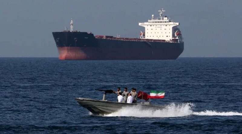 boat with iran flag seen in backdrop an oil tanker