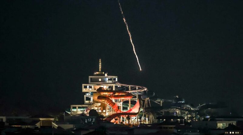 An intercepted projectile falls into the sea near Dubai's Palm Jumeirah archipelago
