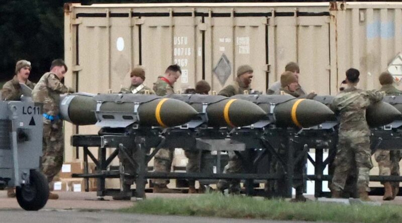 US Air Force personnel load munitions onto bombers at RAF Fairford in southwest England ahead of strikes on Iran