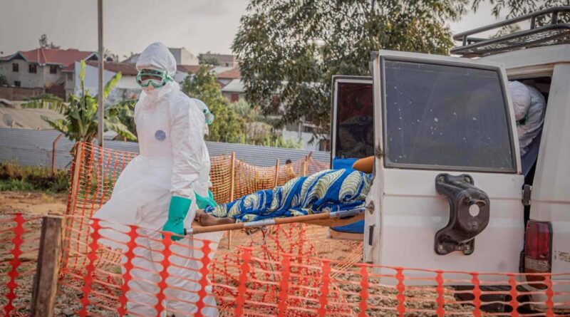 Healthcare workers carry on a stretcher a patient suffering from the Ebola virus disease from an ambulance at the Ebola Treatment Center (ETC) in Bunia, Ituri, in the east of the Democratic Republic of Congo on June 23, 2026