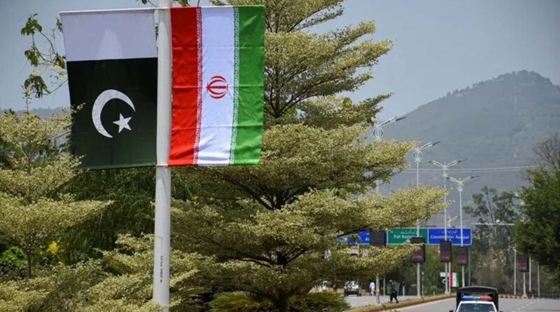 Iranian and Pakistani national flags are displayed along a street ahead of the arrival of Iran's President Masoud Pezeshkian in Islamabad