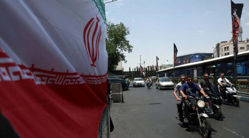 People drive on a street in Tehran, Iran, June 18, 2026