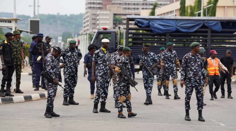 Security personnel stand guard near Eagle Square during a Democracy Day protest in Abuja, Nigeria, June 12, 2026