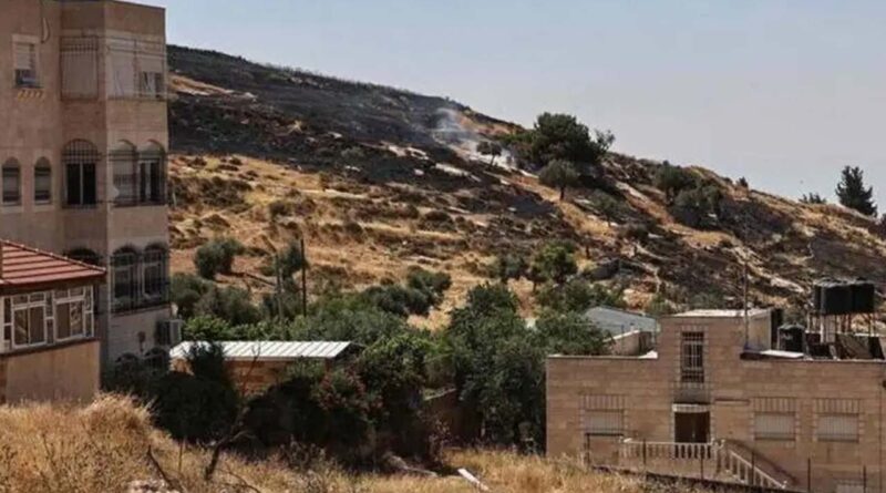 Smoke rises after Israeli settlers reportedly set fire to agricultural fields surrounding the village of Taybeh, in the Israeli-occupied West Bank on June 10, 2026
