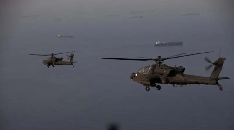 This handout photo released by US Central Command via their X account (@CENTCOM) on April 18, 2026 shows AH-64 Apaches flying above the Strait of Hormuz during a patrol on April 17, 2026