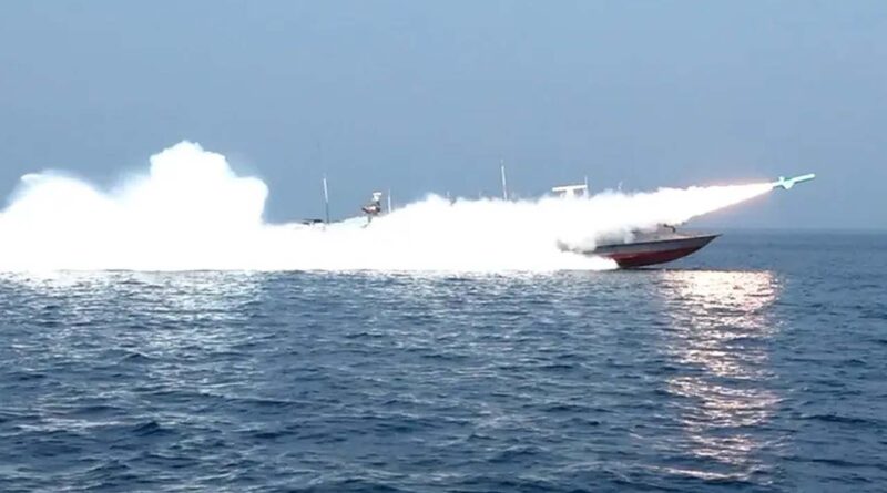 a rocket being fired from a boat during a military exercise by members of the IRGC