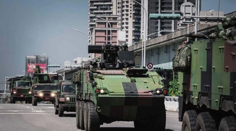 a row of armored military vehicles driving along the highway in Taoyuan, Taiwan